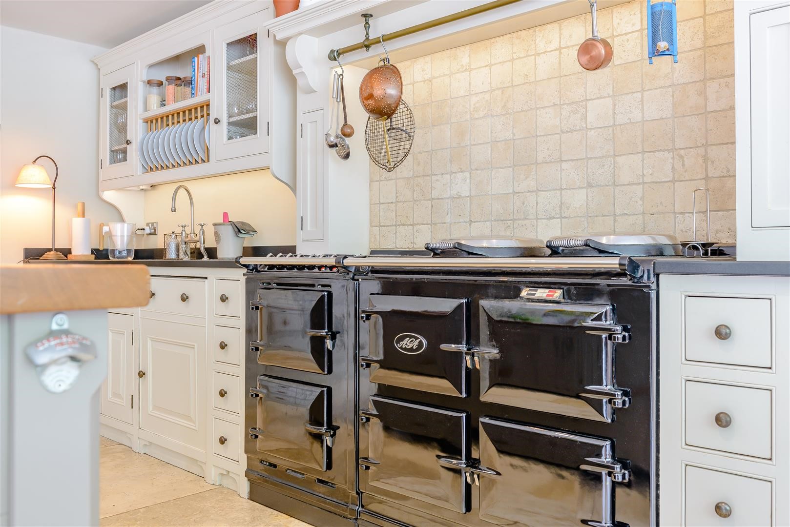 black six door AGA cooker in english shaker kitchen