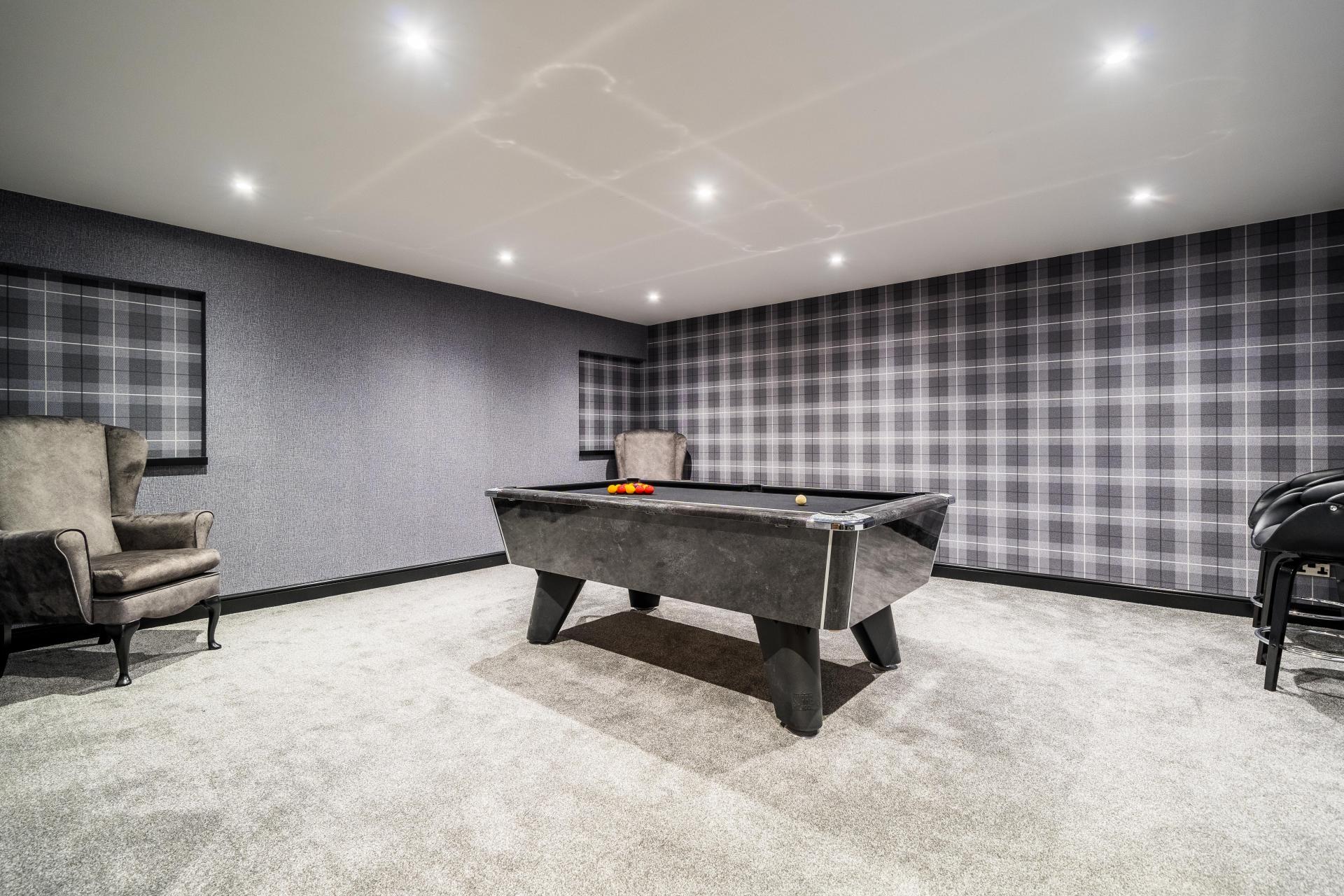 home bar and games room with grey pool table and tartan wallpaper