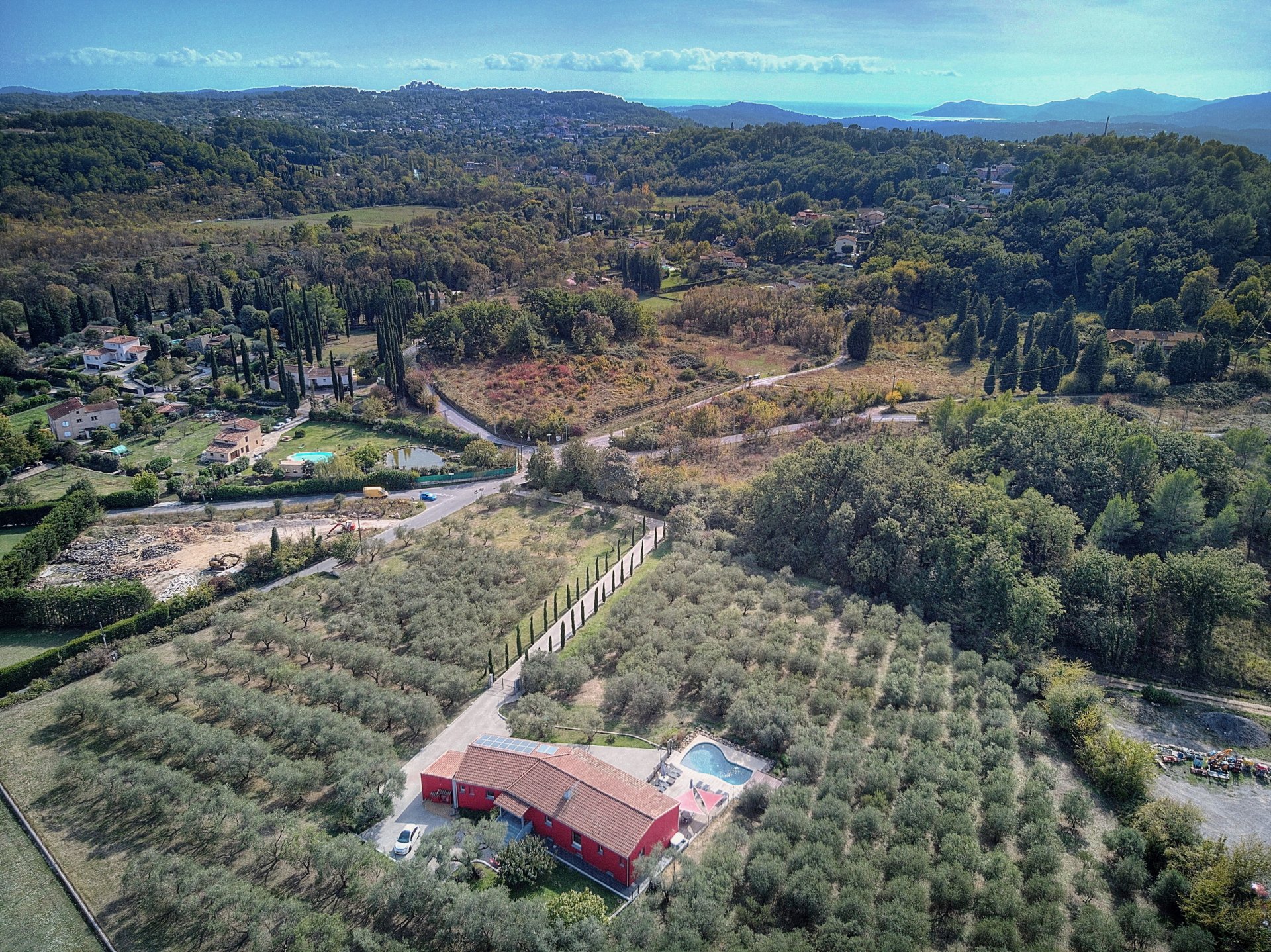 An olive grove with solar panels in Frances