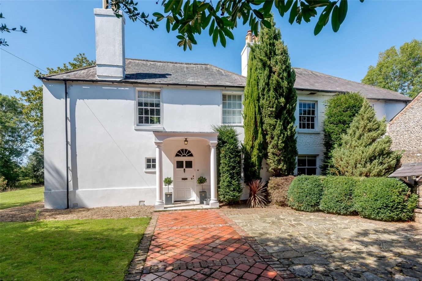 traditional Grade II Listed large white Norman family home