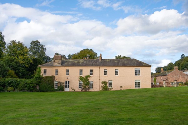 traditional Grade II Listed pink equestrian country manor home