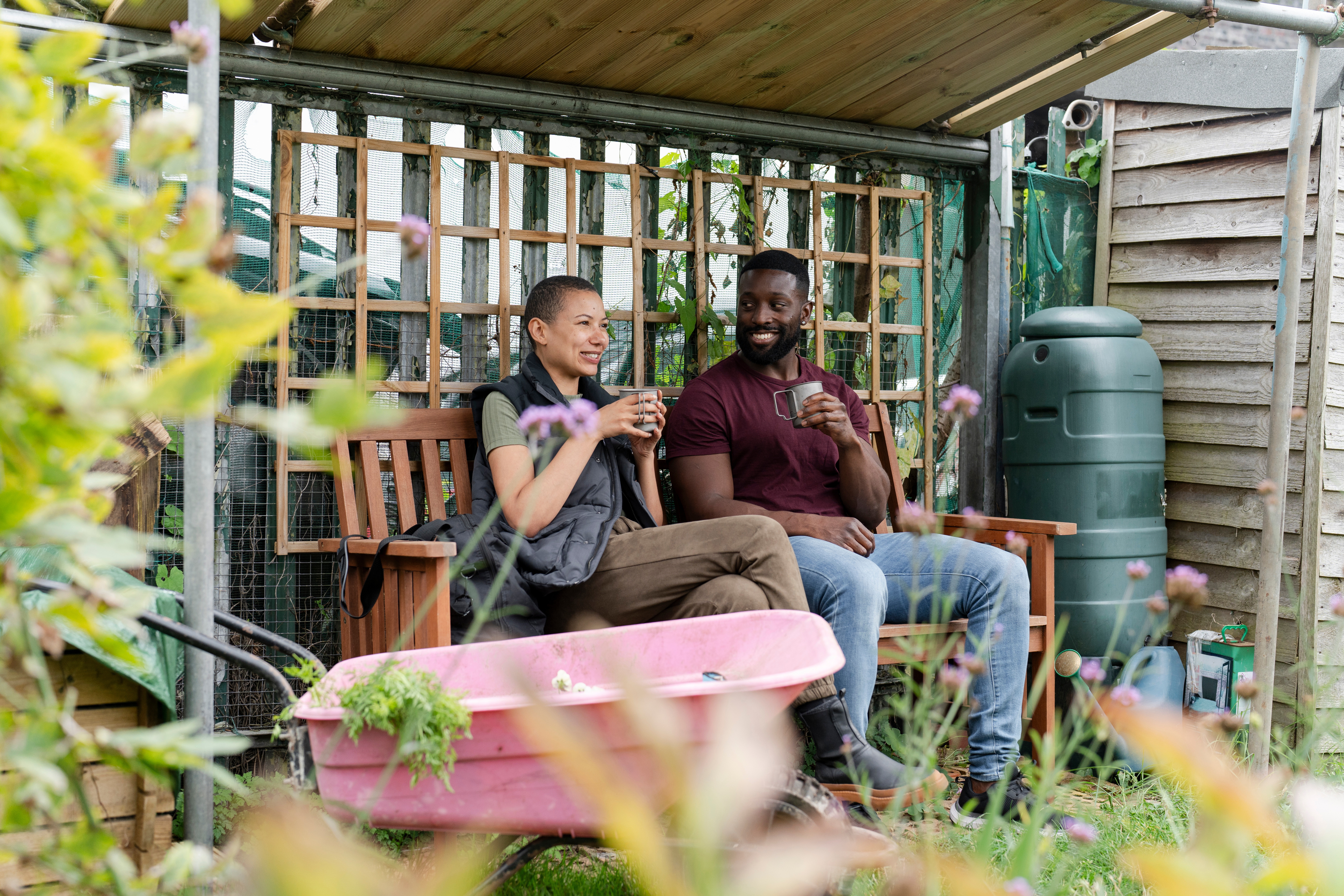 smiling-couple-relaxing-london-outdoor-garden-room