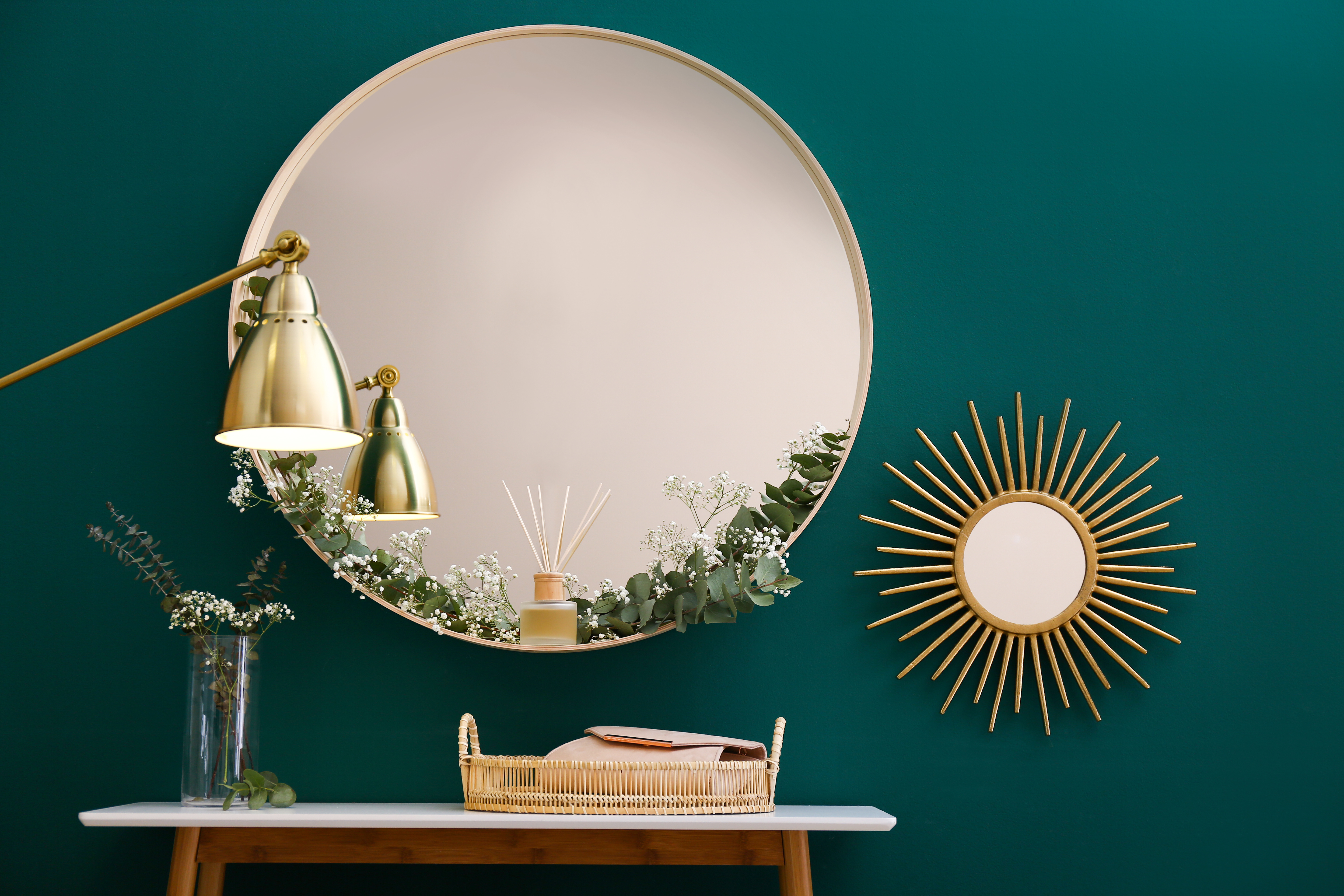 Art Deco interior design gold frame mirrors teal wall colour