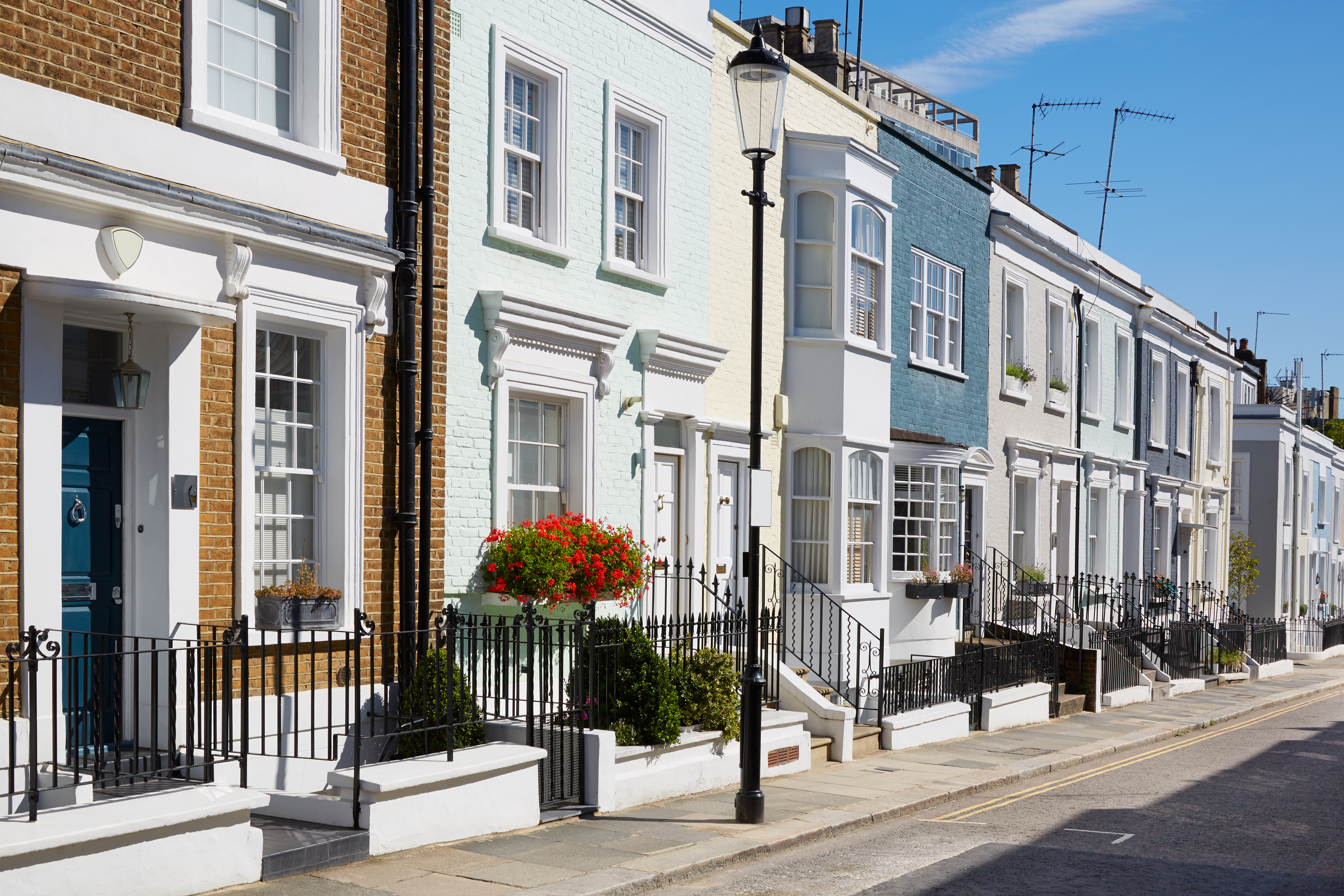 Colorful English houses facades in a sunny day in London