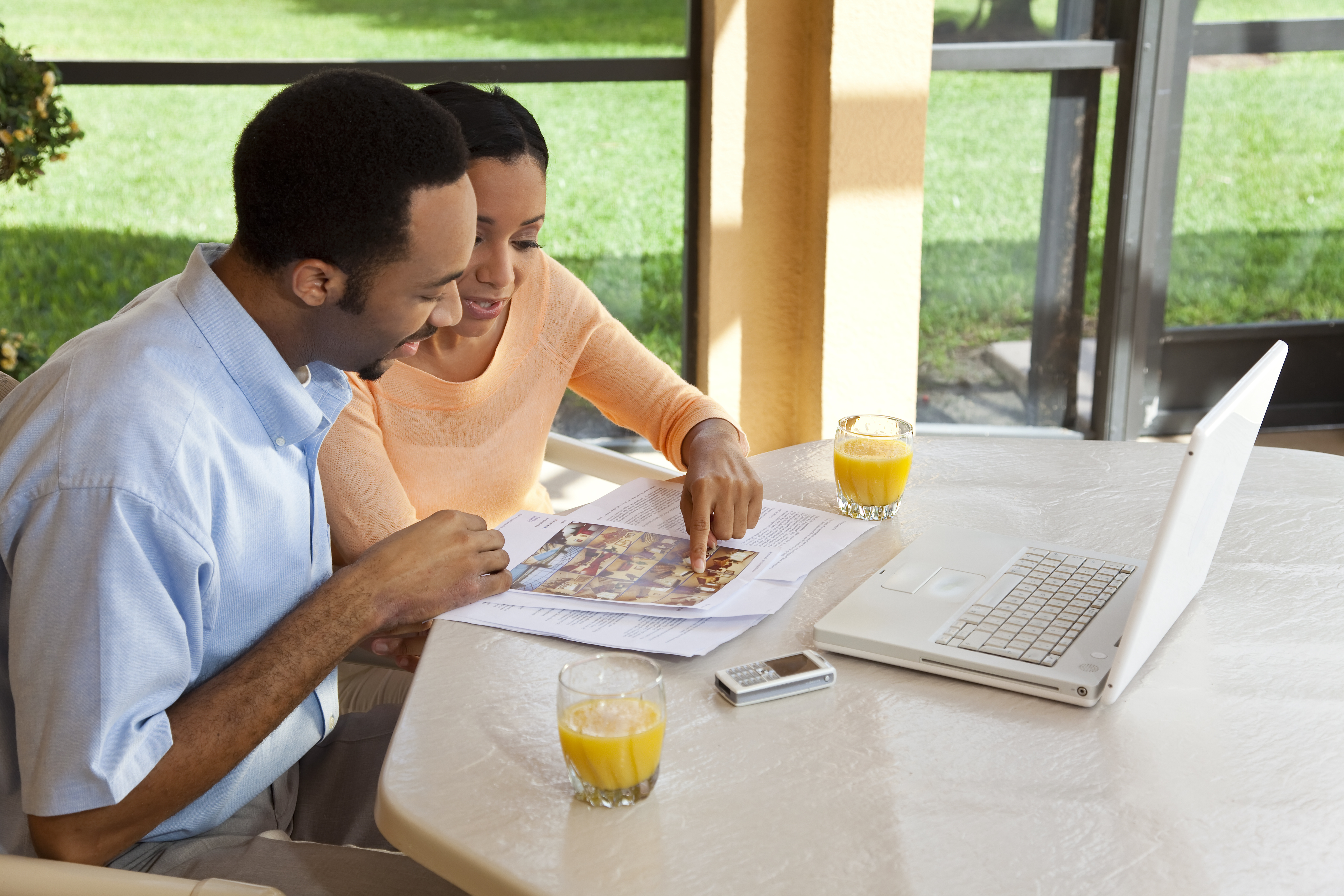 couple_looking_at_properties_estate_agent_house_hunting