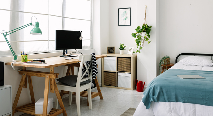 featured_image_renting_to_students_all_you_need_to_know__student_room_with_a_desk_a_shelf_and_a_bed