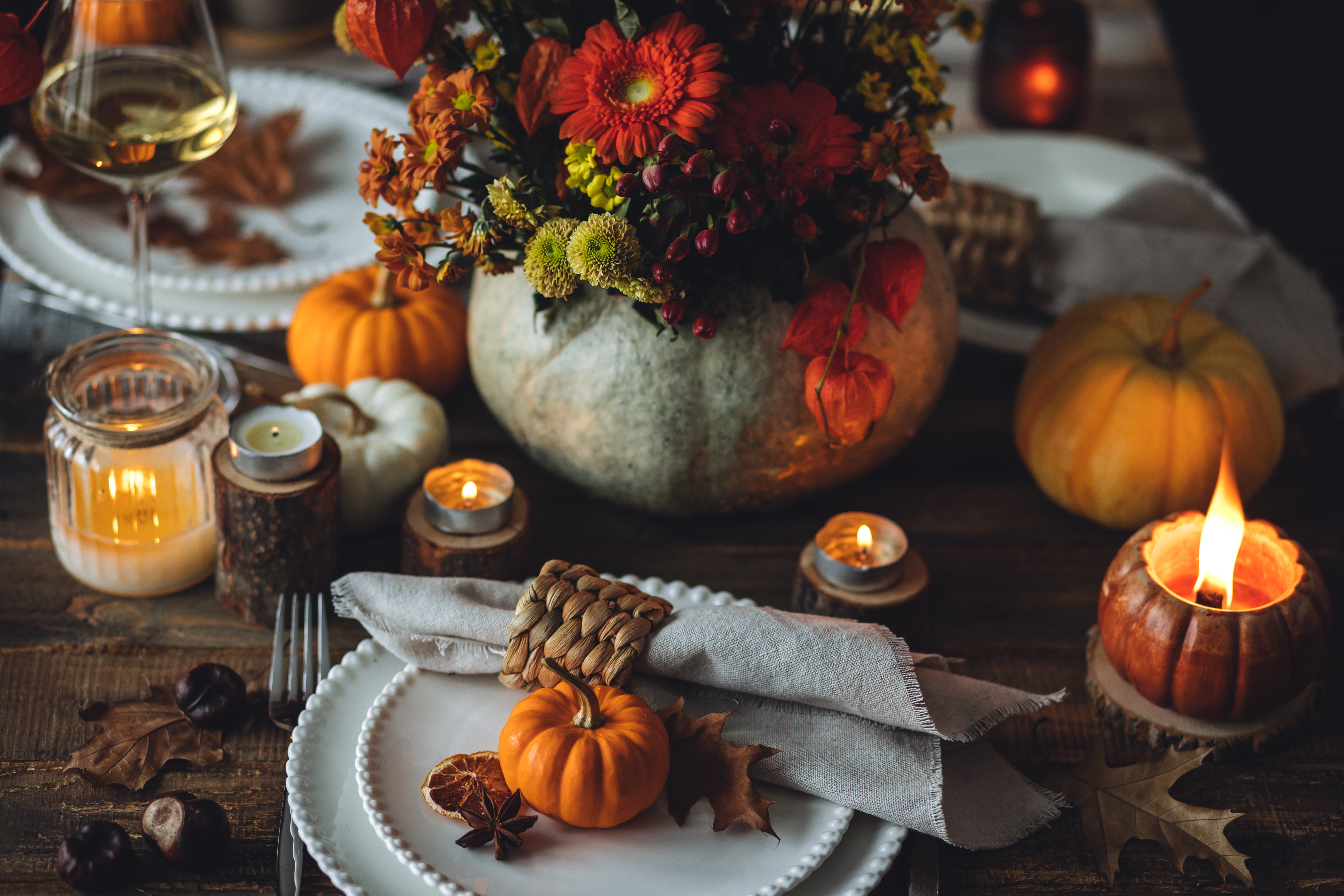 For a more refined party aesthetic, decorate with lanterns, candles and carved pumpkins