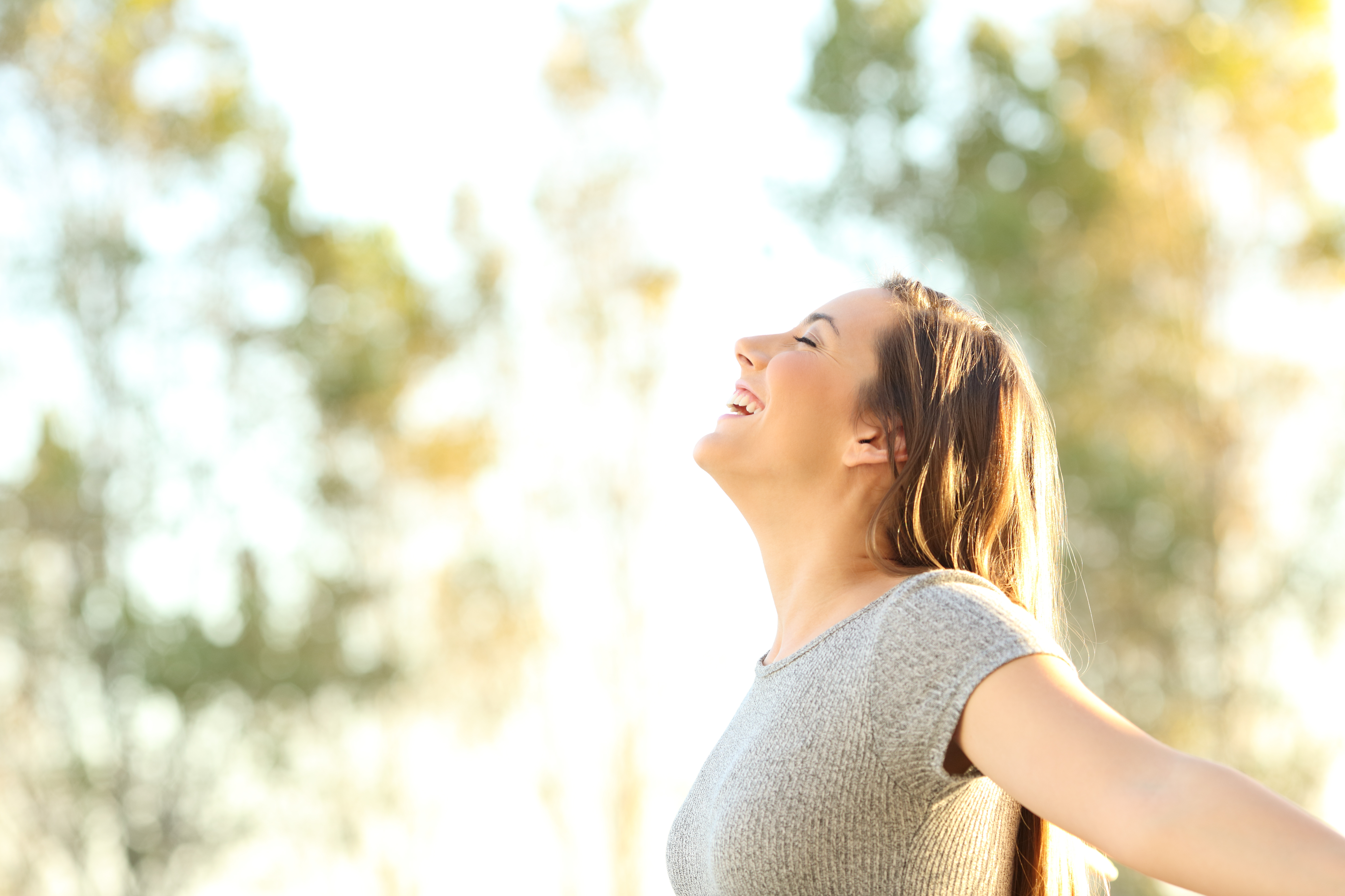 woman happy embracing the fresh air