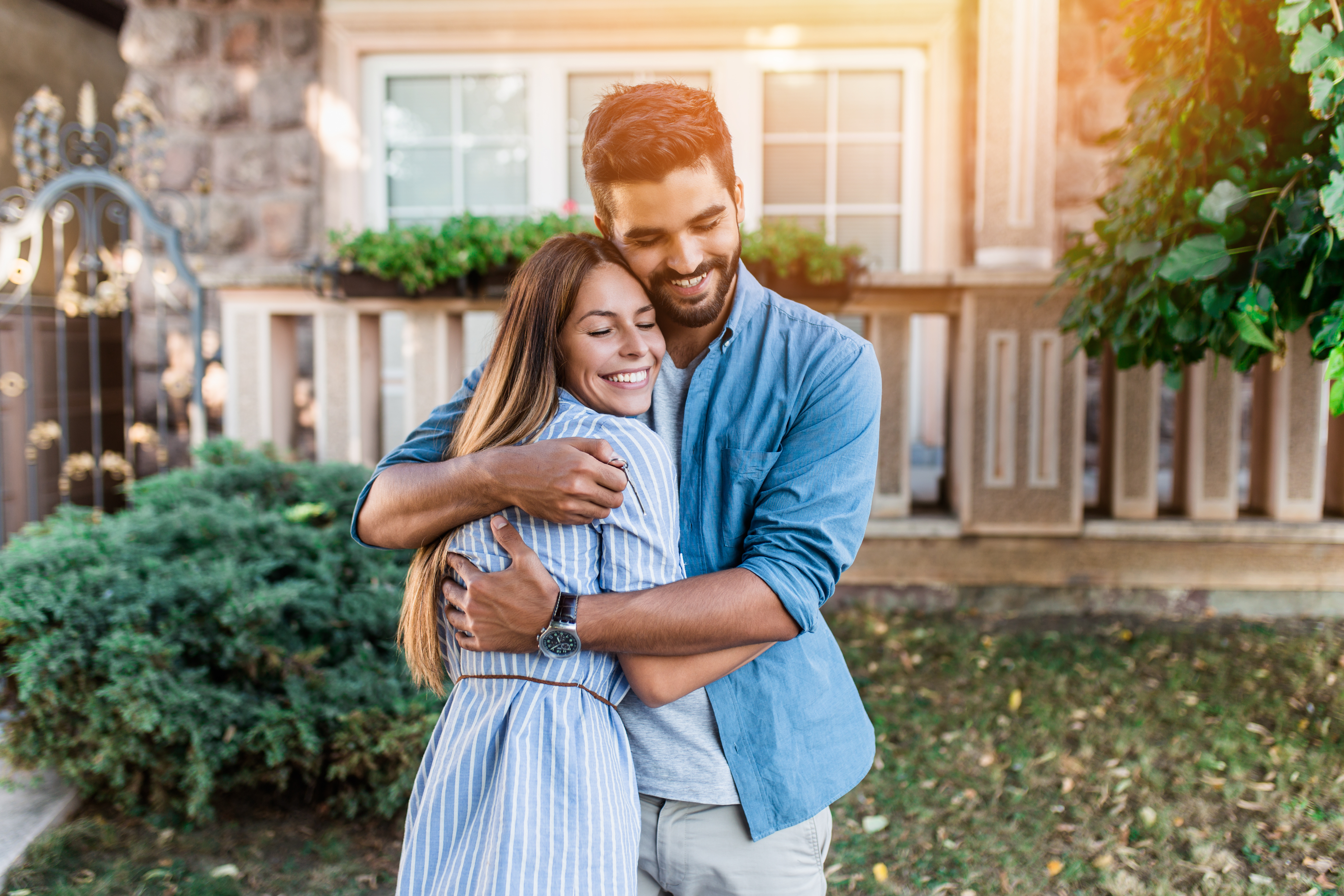 happy couple outside home