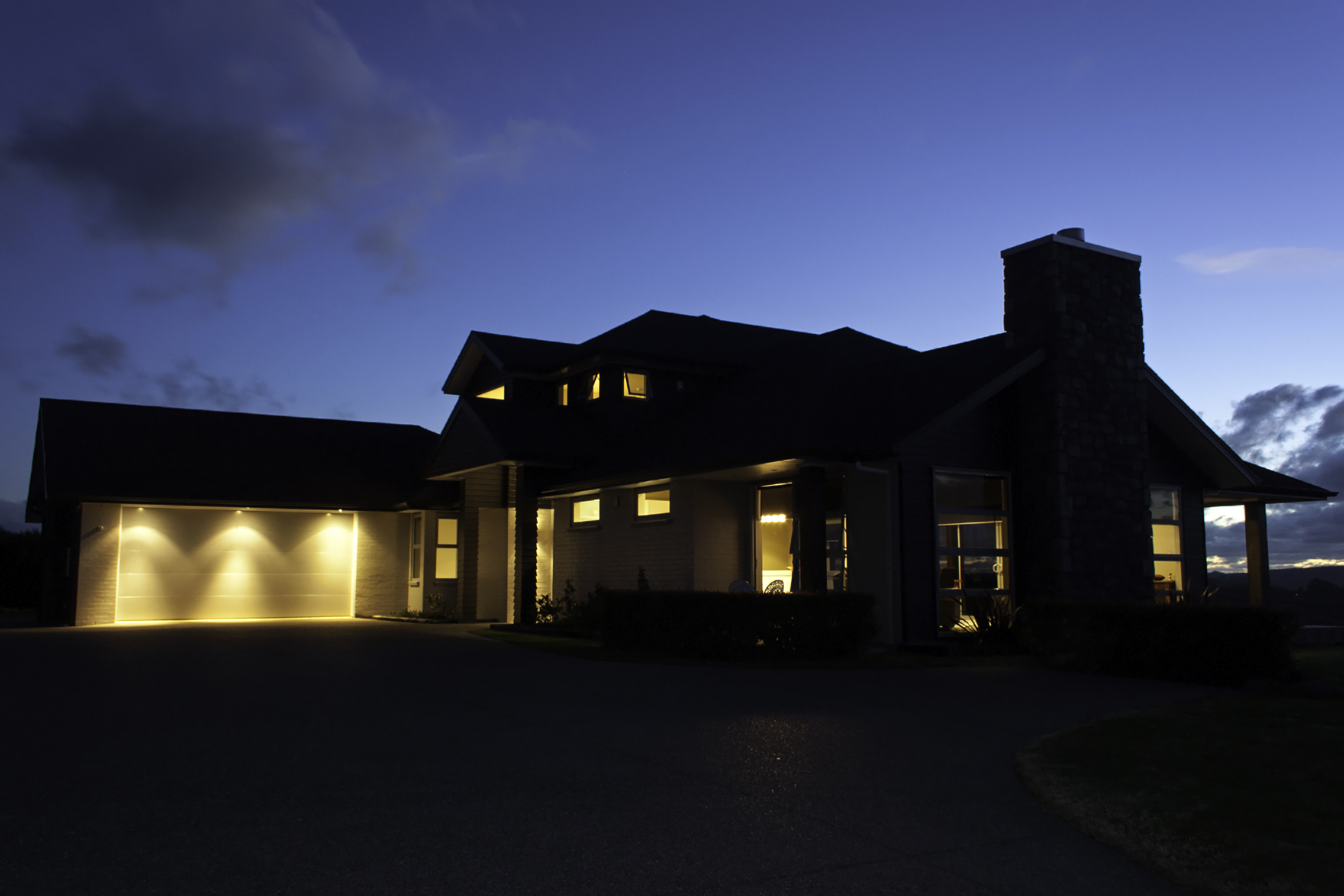 house exterior with lights on at night