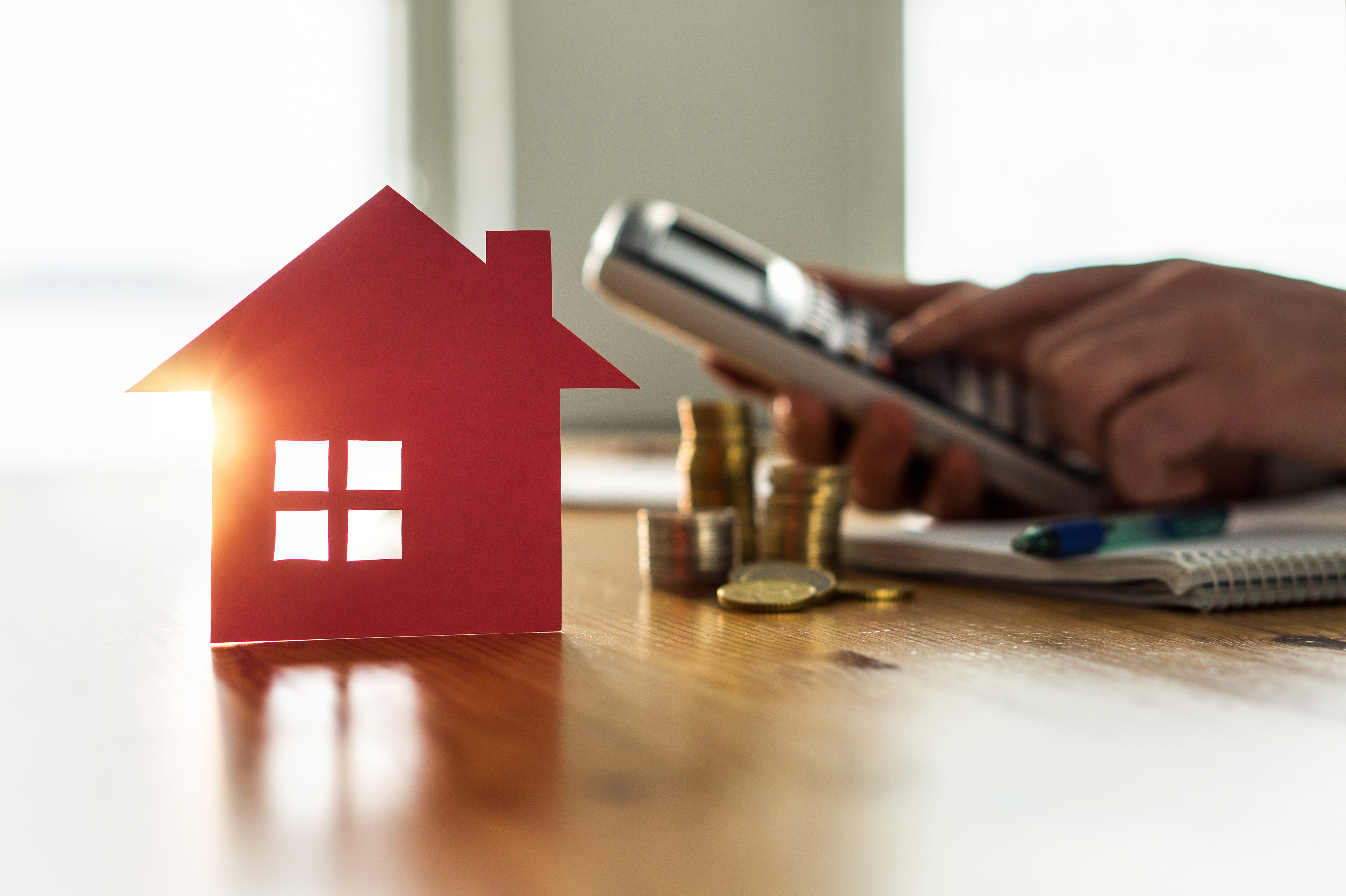 Man using calculator to count rent, money or home insurance cost