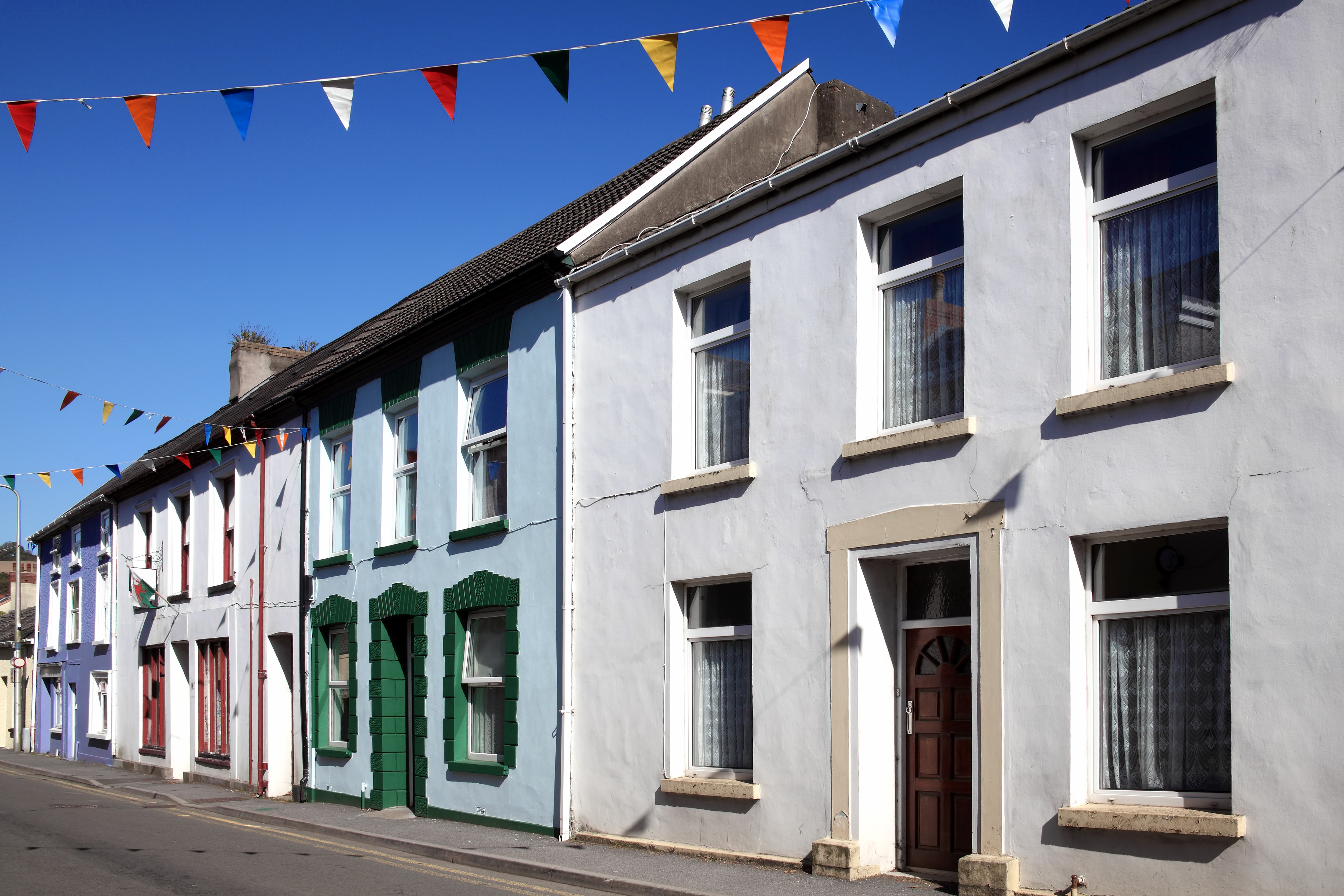 Old fashioned colourful terraced town houses in Kidwelly, Carmarthenshire, Wales, UK