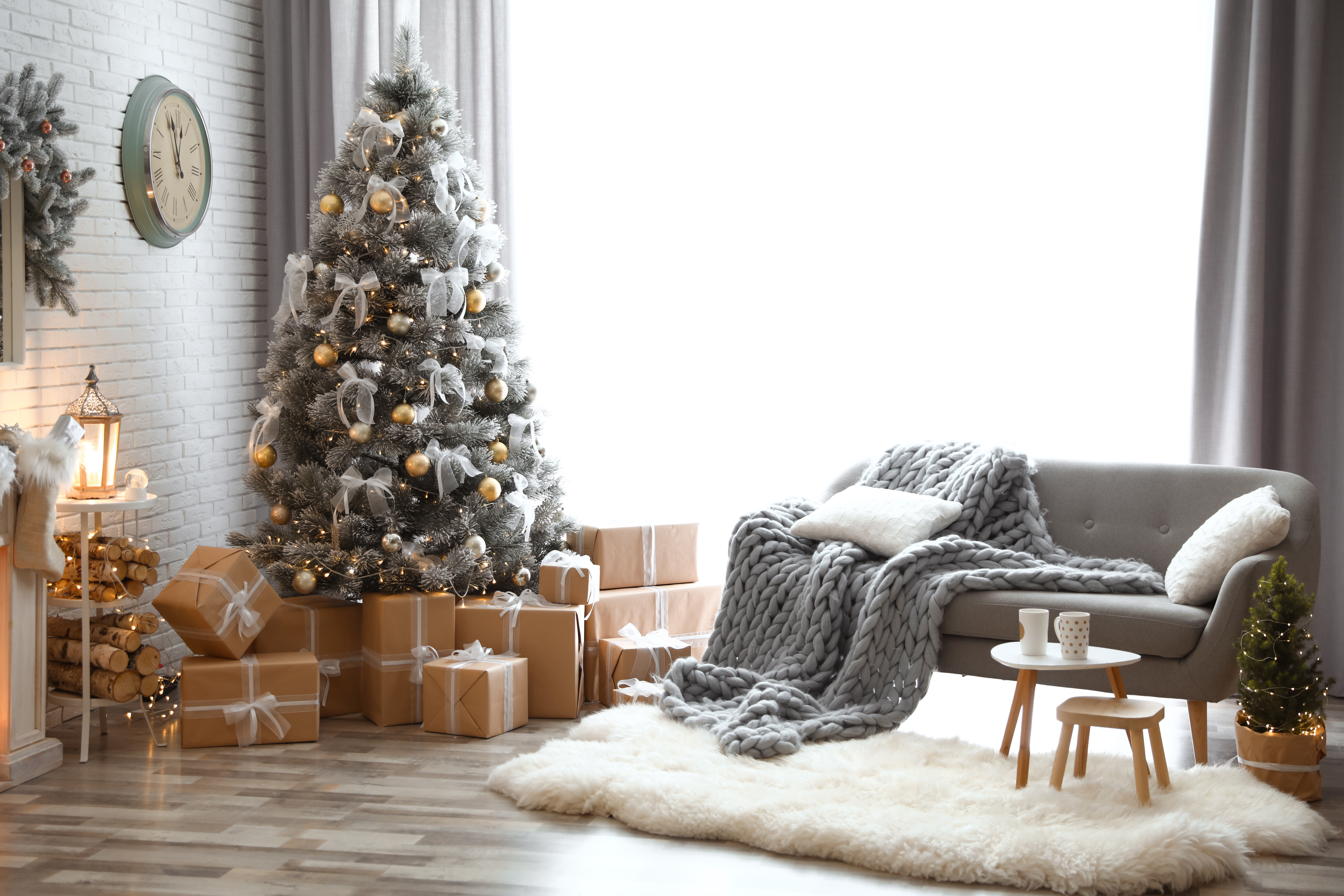 Stylish interior of living room with decorated Christmas tree