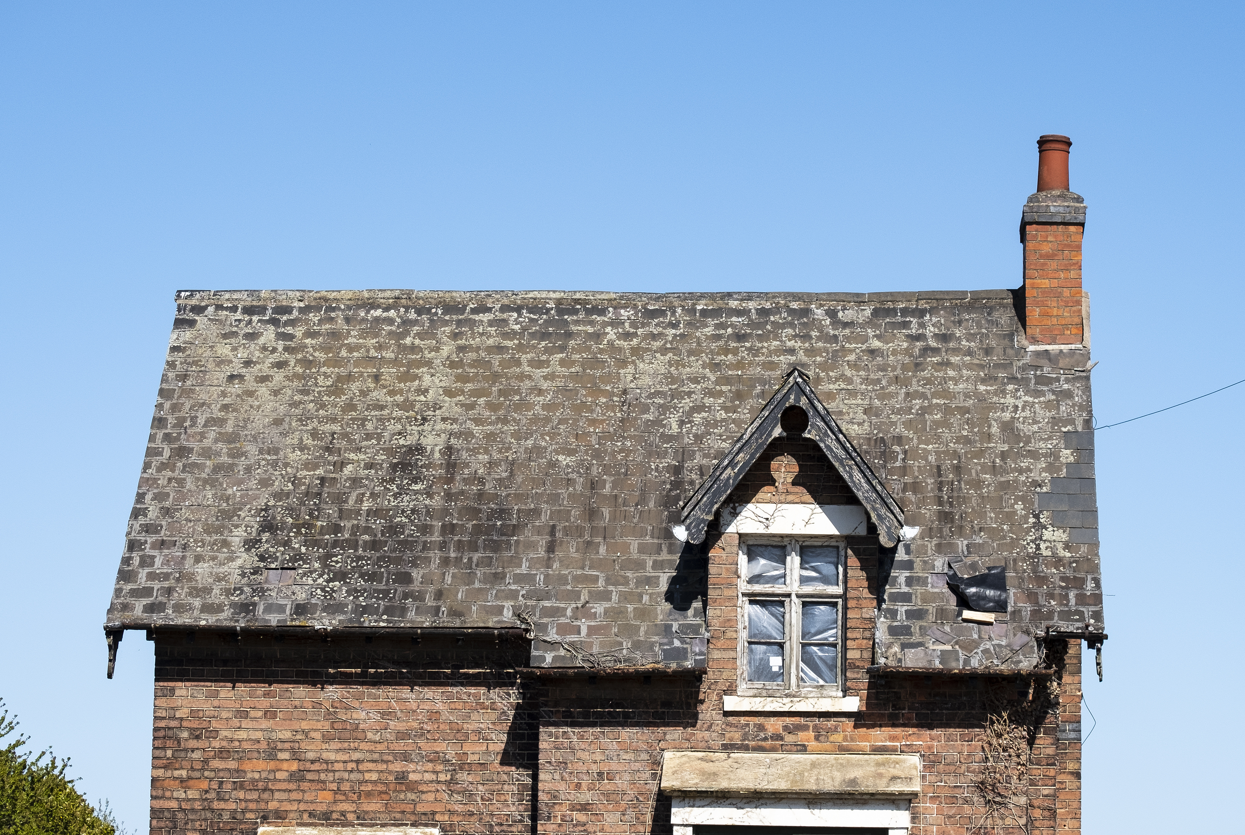 Attic window in an old run down detached house