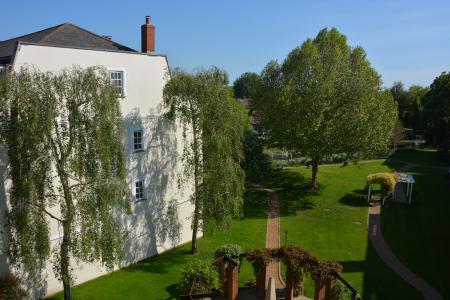 View over communal gardens to River Mole