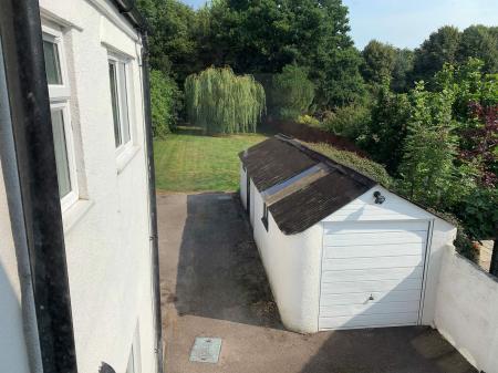 View of garden and storage shed from bedroom 2