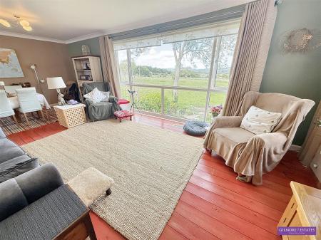 L Shaped Lounge through Dining Room