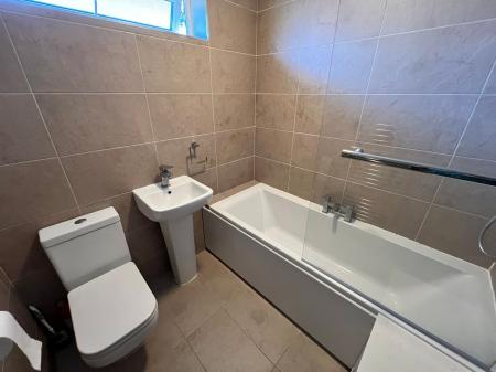 Bathroom with shower over