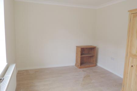 downstairs bedroom - front - left.jpg