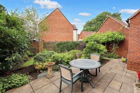 Rear patio and garde