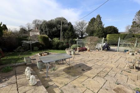 Rear patio and garde