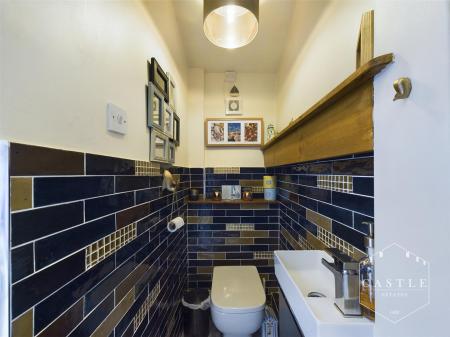 GUEST CLOAKROOM/UTILITY SPACE