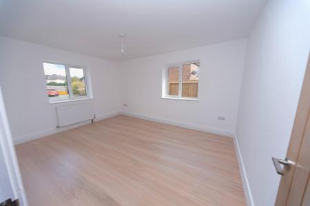 BEDROOM 1 WITH SAMPLE FLOORING.JPG