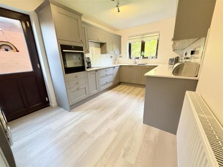 Fitted Kitchen With Utility Area
