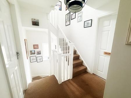 Landing and stairs to second floor
