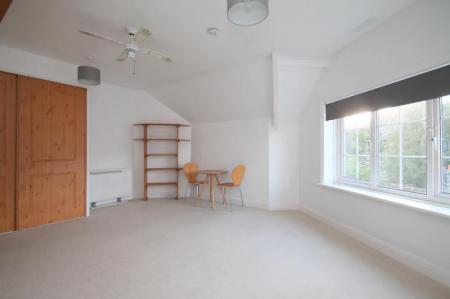 Further shot of studio with fitted wardrobes
