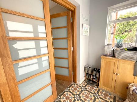 INITIAL ENCLOSED STORM PORCH