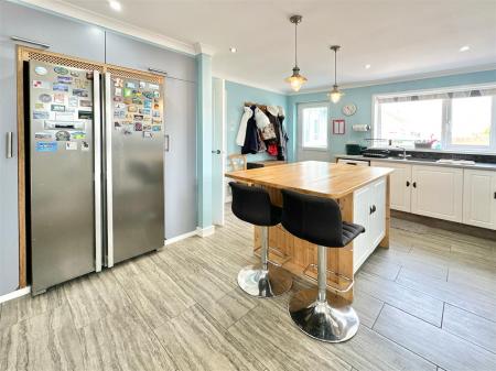 Kitchen Towards Back Door & Living Room.JPG