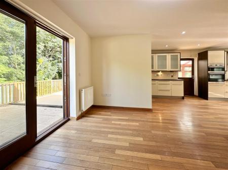 Dining Area Towards Rear Deck & Kitchen.JPG