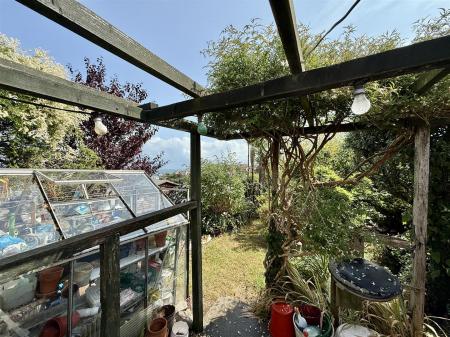 Greenhouse Into Garden.JPG